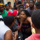 The mother (C) of two girls who died when a landslide knocked the walls of their house down during the passage of Hurricane Matthew, is comforted outside her house in the neighbourhood of Capotillo, in Santo Domingo on October 4, 2016. Matthew, a Category Four hurricane, slammed into the Dominican Republic and Haiti Tuesday, triggering major floods and forcing thousands to flee the path of the storm that has claimed at least three lives in each country. (Image: Getty)